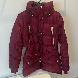 A burgundy puffer coat. Size M